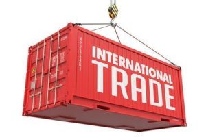 International Trade - Red Cargo Container hoisted with hook Isolated on White Background.