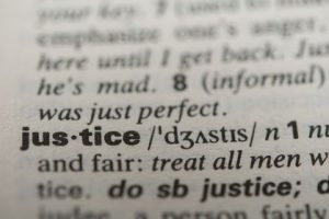 Definition of the word justice, close up